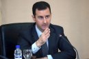 Syria's President Bashar al-Assad heads a cabinet meeting in Damascus