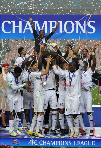 Qatar's Al Sadd players celebrate with the trophy after winning the AFC Champions League football final against South Korea's Jeonbuk Hyundai Motors in Jeonju, some 200 kms south of Seoul, on November 5, 2011. Qatar's Al Sadd beat South Korea's Jeonbuk Hyundai Motors 4-2 in a dramatic penalty shoot-out to win the AFC Champions League title. AFP PHOTO / KIM JAE-HWAN (Photo credit should read KIM JAE-HWAN/AFP/Getty Images)