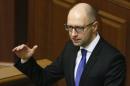 Ukraine's Prime Minister Yatseniuk speaks to deputies as he presents a work plan of his government during a parliament session in Kiev