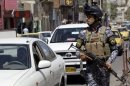 Gunmen opened fire on a police checkpoint in Mosul today killing a policeman and a civilian