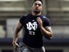 FILE - In this March 26, 2013, file photo, linebacker Manti Te'o runs the 40 yard sprint during Notre Dame's NFL football pro day in South Bend, Ind.  Some analysts have Notre Dame's All-American linebacker Mante Te'o back to being a first-round cinch, even after a great season was marred by a poor game against Alabama followed by the hoax involving a deceased "girlfriend." He did not perform well at the NFL combine but did better at pro day in South Bend. Te'o is one of the people to watch for during the three-day NFL draft beginning Thursday, April 25, 2013. (AP Photo/Joe Raymond, File)