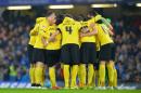 Watford players huddle before kick off of the English FA Cup third round football match in London on January 4, 2015