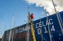 A man works during preparations at the complex where the CELAC summit will be held, in Havana on January 18, 2014