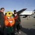 Alabama's Barrett Jones, left, and Chance Warmack, right, pose with Obie, the Orange Bowl Committee mascot, upon arriving at Miami International Airport, Wednesday, Jan. 2, 2013, in Miami. Alabama is scheduled to play Notre Dame in the BCS national championship NCAA college football game next Monday. (AP Photo/Wilfredo Lee)