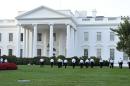 Uniformed Secret Service officers walk along the lawn on the North side of the White House in Washington, Saturday, Sept. 20, 2014. The Secret Service is coming under intense scrutiny after a man who hopped the White House fence made it all the way through the front door before being apprehended. (AP Photo/Susan Walsh)