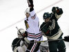 Chicago Blackhawks' Patrick Sharp, center, celebrates his goal off Minnesota Wild goalie Josh Harding, left, in the first period of Game 4 of an NHL hockey Stanley Cup playoff series, Tuesday, May 7, 2013 in St. Paul, Minn. At right is Wild's Jared Spurgeon (AP Photo/Jim Mone)