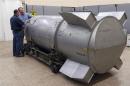 Workers examine a B53 nuclear bomb at B&W Pantex nuclear weapons storage facility outside Amarillo in handout photograph