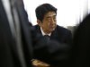 Shinzo Abe, Japan's incoming PM, attends a meeting at the LDP headquarters in Tokyo