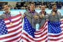 From left, United States' Michael Phelps, United States' Conor Dwyer, United States' Ricky Berens and United States' Ryan Lochte pose with their gold medals for the men's 4x200-meter freestyle relay swimming final at the Aquatics Centre in the Olympic Park during the 2012 Summer Olympics in London, Tuesday, July 31, 2012. (AP Photo/Mark J. Terrill)