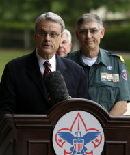 FILE - In this Thursday, May 23, 2013 file photo, Boy Scouts of America Chief Scout Executive Wayne Brock, addresses questions during a news conference accompanied by BSA National President Wayne Perry, background right, in Grapevine, Texas. Brock has pleaded for the Scouting community to reunite after the divisive debate that led to Thursday's vote by the BSA's National Council. The proposal to lift the ban on openly gay youth - while keeping the ban on gay adults - was supported by about 60 percent of the councils 1,400 voting members. (AP Photo/Tony Gutierrez)