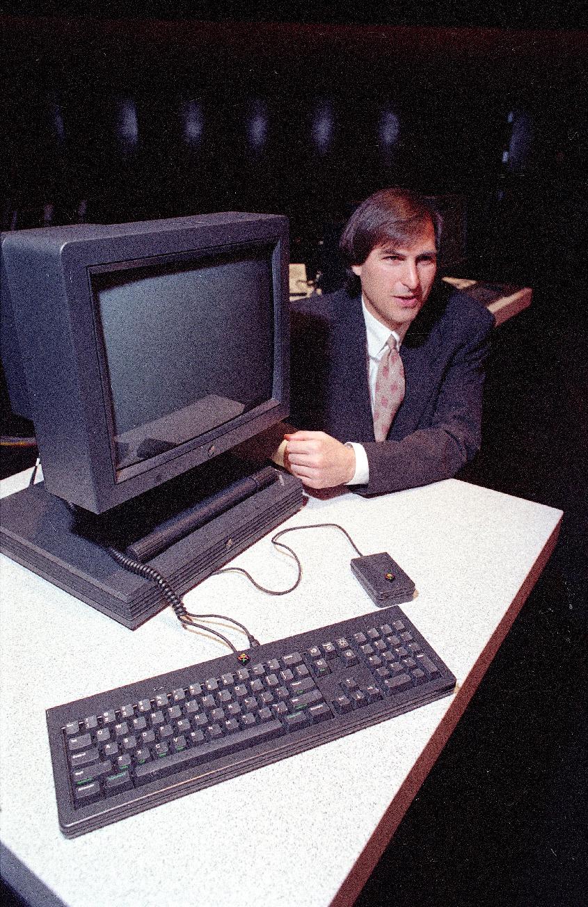 1990 - Steve Jobs, president and CEO of NeXT Computer Inc., shows off his company&#39;s new NeXTstation after an introduction to the public in San Francisco. Apple on Wednesday, Oct. 5, 2011 said Jobs
