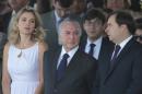 Brazil's President Michel Temer, center, and wife Marcela Temer, watch an Independence Day military parade in Brasilia, Brazil, Wednesday, Sept. 7, 2016. Pictured right is Lower House Speaker Rodrigo Maia. (AP Photo/Eraldo Peres)