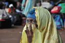 A displaced woman waits to leave Central Africa at Bangui airport on January 30, 2014
