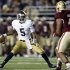 Notre Dame quarterback Everett Golson looks for an opening around Boston College Eagles defensive end Mehdi Abdesmad during the first half of an NCAA college football game in Boston on Saturday, Nov. 10, 2012. (AP Photo/Winslow Townson)