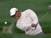 Tiger woods hits out of a bunker on the 13th hole during the first round of the Honda Classic golf tournament, Thursday, Feb. 28, 2013, in Palm Beach Gardens, Fla. (AP Photo/Wilfredo Lee)