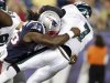 Patriots linebacker Jermaine Cunningham sacks Eagles quarterback Michael Vick during the first quarter of their preseason NFL football game in Foxborough