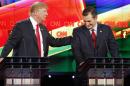 Donald Trump, left, and Ted Cruz joke about remarks Cruz has made about Trump's temperament during the CNN Republican presidential debate at the Venetian Hotel & Casino on Tuesday, Dec. 15, 2015, in Las Vegas. (AP Photo/John Locher)