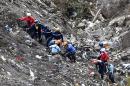 Investigators work at the crash site of the Germanwings plane in the French Alps, on March 26, 2015