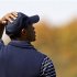 U.S. golfer Woods reacts after missing a birdie putt to lose the second hole during the afternoon four-ball round at the 39th Ryder Cup golf matches at the Medinah Country Club
