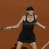 Russia's Maria Sharapova returns the ball to Czech Republic's Petra Kvitova during their semifinal match in the French Open tennis tournament at the Roland Garros stadium in Paris, Thursday, June 7, 2012.  (AP Photo/Michel Spingler)