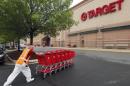 A Target employee returns carts to the store in Falls Church