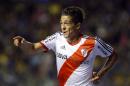 River Plate's Manuel Lanzini celebrates after scoring against Boca Juniors during an Argentine league soccer match in Buenos Aires, Argentina, Sunday, March 30, 2014. (AP Photo/Victor R. Caivano)