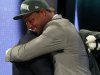 FILE - In this April 26, 2012,  file photo, North Carolina defensive end Quinton Coples, right, hugs NFL Commissioner Roger Goodell after being selected as the 16th pick overall by the New York Jets in the first round of the NFL football draft in New York. How many hugs can Roger Goodell endure from all the burly offensive and defensive players expected to be selected in the first round? Last year, he embraced many first-round picks who took the stage and was nearly hugged into submission_one of the things to watch for during the three-day NFL draft beginning Thursday, April 25, 2013. (AP Photo/Jason DeCrow, File)