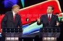 In this Dec. 15, 2015 photo, Donald Trump, left, watches as Ted Cruz speaks during the CNN Republican presidential debate at the Venetian Hotel & Casino in Las Vegas. A growing debate over America's role in promoting regime change in the Middle East is creating unusual alliances among 2016 presidential candidates that cross party lines. (AP Photo/John Locher)