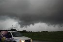 Storm chasers follow a large cloud lowering between Perkins, Oklahoma and Cushing