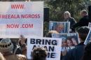 Judy Gross (top-L), wife of imprisioned US citizen Alan Gross, who has been held in a Cuban prison for four years, calls on US President Barack Obama to help free her husband on December 3, 2013