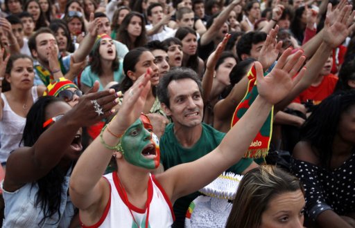 Portuguese soccer fans react during the semi final Euro 2012 soccer match between the Portugal and Spain at a public screening in Lisbon