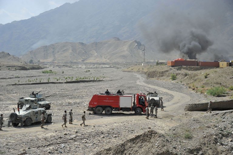 Smoke rises from close to a US military base in Torkham near the Pakistan border on September 2, 2013