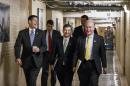 Front row, from left, House Ways and Means Committee Chairman Rep. Paul Ryan, R-Wis., House Financial Services Committee Chairman Rep. Jeb Hensarling, R-Texas, and Rep. Tom Price, R-Ga., walk through a basement corridor on Capitol Hill in Washington, Tuesday, Jan. 27, 2015, as they head to a meeting of the Republican Conference. (AP Photo/J. Scott Applewhite)