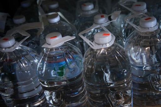 An Australian woman is suing a deli after drinking bottled water that allegedly contained semen, lawyers said Friday, with claims that DNA showed it matched the owner of the business