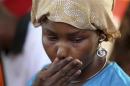Protester cries during a sit-in rally for the abducted schoolgirls, at the Unity Fountain in Abuja