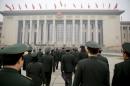 Military delegates arrive at the Great Hall of the People before a meeting ahead of the National People's Congress in Beijing