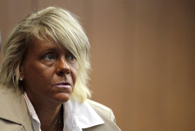 FILE - In this May 2, 2012 file photo, Patricia Krentcil, 44, waits to be arraigned at the Essex County Superior Court in Newark, N.J., where she appeared on charges of endangering her 5-year-old child by taking her into a tanning salon. A grand jury in New Jersey has decided to let Krentcil a woman who gained overnight notoriety as "the tanning mom" bronze away in peace. Prosecutors in Newark said Tuesday, Feb. 26, 2013 a grand jury refused to indict Patricia Krentcil on a charge she took her young daughter into a tanning booth with her. (AP Photo/Julio Cortez, File)