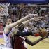 Miami Heat's LeBron James (6) tries to get a shot past Philadelphia 76ers' Spencer Hawes, left, and Jrue Holiday in the first half of an NBA basketball game, Wednesday, March 13, 2013, in Philadelphia. (AP Photo/Matt Slocum)