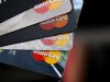 In this Thursday, April 25, 2013, photo, MasterCard credit cards are displayed for a photographer in Montpelier, Vt. MasterCard Inc. reports quarterly financial results before the market opens on Wednesday, May 1, 2013. (AP Photo/Toby Talbot)