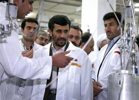Iranian President Mahmoud Ahmadinejad (C) visits the Natanz nuclear enrichment facility, 350 km (217 miles) south of Tehran, April 8, 2008. REUTERS/Presidential official website/Handout