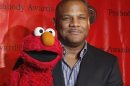 File phto of voice actor kevin Clash with Elmo for the 2010 Peabody Award ceremony in New York