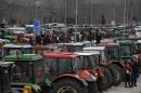 FILE - In this Wednesday, Jan. 20, 2016 file photo, protesting farmers from the agricultural region of Thessaly park their tractors in the Vale of Tempe, central Greece. Protest organizers said on Tuesday, Feb. 9, 2016 that the tractor blockade on the highway linking Athens to Greece's second largest city, Thessaloniki, would be in effect indefinitely unless the government withdrew proposals for tax hikes and an overhaul of the pension system. (AP Photo/Thanassis Stavrakis, File)