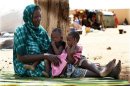 Malians displaced by war gather at a makeshift camp in Sevare northeast of the capital Bamako
