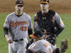 Baltimore Orioles' Mark Reynolds and Manny Machado embrace as teammates Jim Johnson, left, and Matt Wieters approach after the Orioles defeated the New York Yankees 2-1 in Game 4 of the American League division baseball series Thursday, Oct. 11, 2012, in New York. (AP Photo/Peter Morgan)