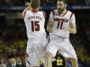 Louisville's Luke Hancock (11) and Louisville's Tim Henderson reacts to play against Wichita State during the second half of the NCAA Final Four tournament college basketball semifinal game Saturday, April 6, 2013, in Atlanta. (AP Photo/John Bazemore)