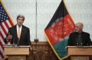 U.S. Secretary of State John Kerry and Afghanistan's President Ashraf Ghani deliver remarks to reporters at Dilkusha Palaceâ€Ž in Kabul