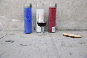 Candles, wine, and bread are left in response to attacks&nbsp;&hellip;