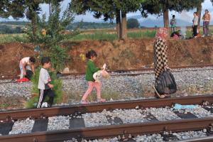 A family walks along the railway line on the Greece-Macedonia&nbsp;&hellip;