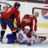 Capitals goalie Neuvirth reacts after Desharnais of Montreal Canadiens crashed the crease during NHL hockey game in Washington