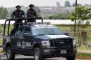 Federal Police patrol on August 9, 2013 outside the Puente Grande State prison in Zapotlanejo, Jalisco State, where former cartel boss Rafael Caro Quintero was being held